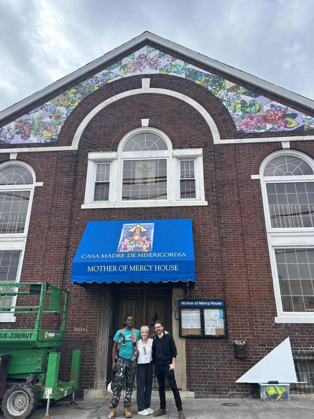 Mural artists with Dianne Hoffmann outside Mother of Mercy House